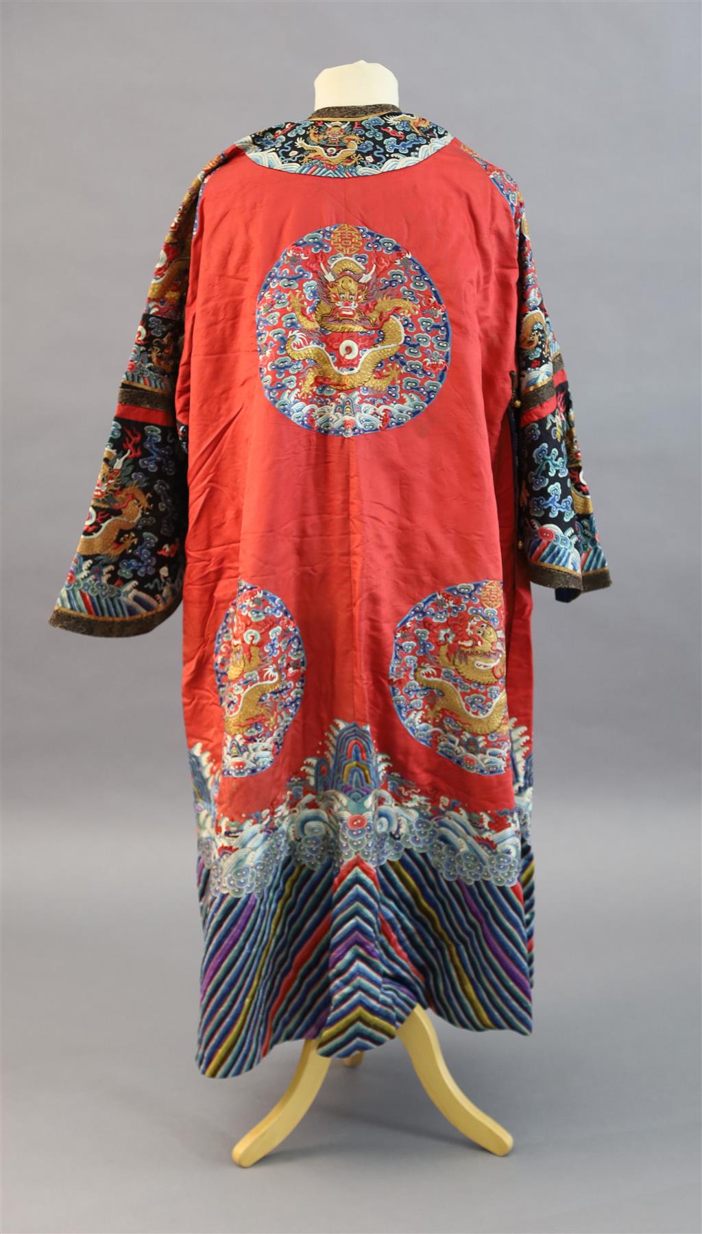 A Chinese red satin dragon winter robe, late Qing dynasty, length 129cm